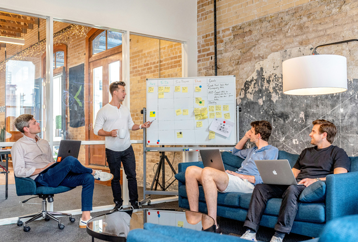 A team of professionals having a casual meeting in a modern office space.